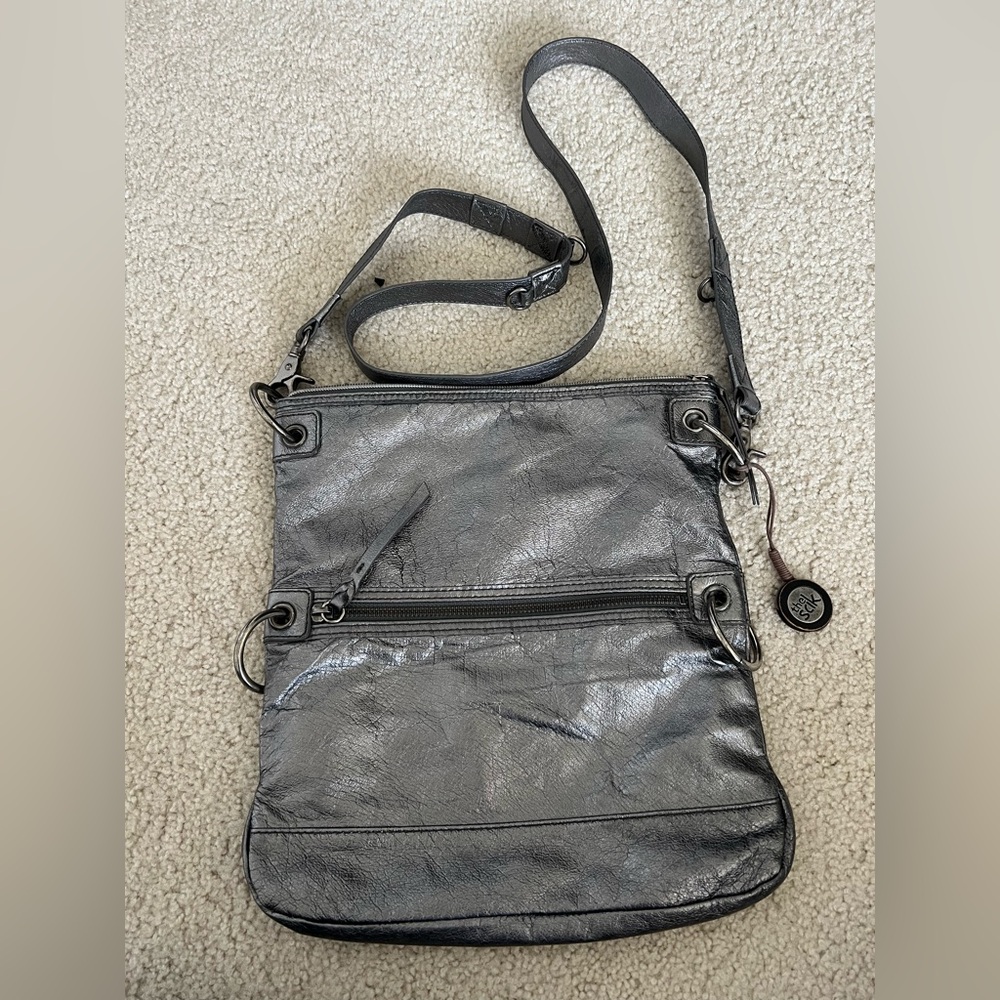 The Sak Metallic Silver Fold Over Convertible Crossbody Bag adjustable